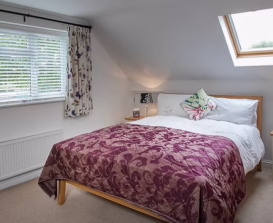 One of the king sized beds in the accommodation at Heather's B&B